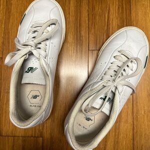 New Balance ~ Rare Tennis shoes. Great shape! White with green marking on sole.